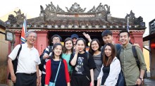 Students arrive in Da Nang, Vietnam. Here, they are standing at the entrance of “Hoi An Covered Bridge”. Photo: Timothy Tse.