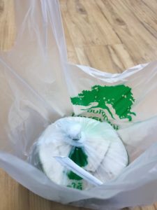 a coconut is wrapped in multiple layers of plastic