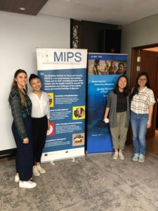 CAS students in Yangon, Myanmar pose with MIPS banners