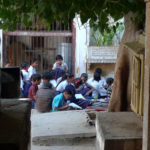 School children studying in a courtyard