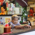 Old lady behind the counter at a restaurant