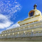 White and yellow shrine under a blue sky