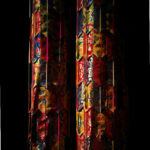 Colourful Tibetan cloth against a black background