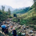 Following our local hosts walking past streams, bamboo growths and rice fields, we had trouble keeping up in our shoes while they were in plastic sandals.