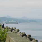 Two local boys fishing at the seaside of the southernmost of Honshu, Japan