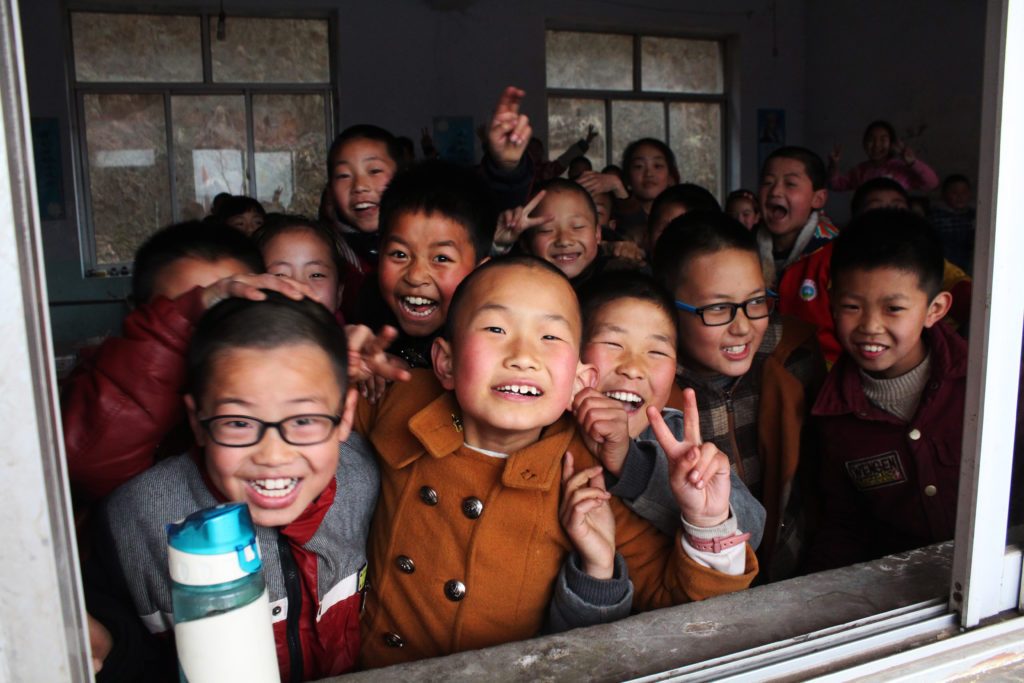 Students in the window at a school in Shanxi, China.