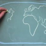 Clip of hand drawing global map in chalk taken from student video by Alexa Waud