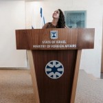 Student Danielle Pal standing at the podium of the State of Israel Ministry of Foreign Affairs