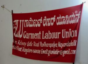 A banner hanging in the Garment Labour Union office in Peenya, Bangalore.