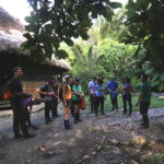 The group learning about the local people, cultures, and biodiversity before setting off for a hike in the Amazon