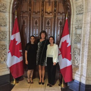 Maria-Alba Benoit Maraica with MP Damoff and fellow participant Yara at the doors to the House of Commons.