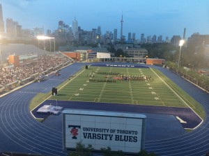 Photo of packed stands at Varsity Stadium at dusk