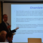 Classroom Picture of Wilson Prichard presenting ICTD findings