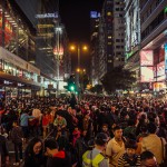 Wide shot of large crowd in Hong Kong, by Alexander Synaptic: https://www.flickr.com/photos/synapticism/13782894124