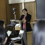 Lynette Ong lectures to a room full of students.