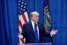 Donald Trump speaks at a podium.