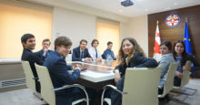 Students sitting in a boardroom
