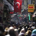 People fill an open market in the historic Sultanahmet district of Istanbul.