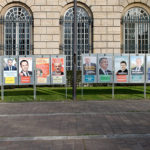 Campaign posters line a street in France