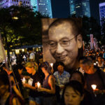 Crowds hold a candlelight vigil for Chinese dissident Liu Xiaobo