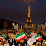 Crowds of protesters in front of the Iranian embassy in Paris, France.