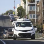 A Chevrolet Bolt electric vehicle, being operated with self-driving technology, makes its way around San Francisco.
