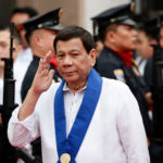 President Rodrigo Duterte reviews an honor guard in Manila.