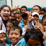 Kana Shishikura poses with students from an Indonesian boarding school.