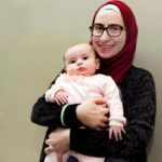 Noura Al-Jizawi holds her 3-month-old daughter.