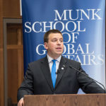 Prime Minister Juri Ratas speaks to a packed crowd at the Munk School of Global Affairs