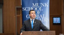 Prime Minister Juri Ratas speaks to a packed crowd at the Munk School of Global Affairs