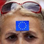 A woman attends a demonstration against Hungarian Prime Minister Viktor Orban in Budapes