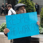 A unionized worker picketing