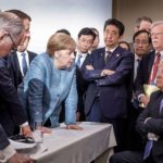 French President Emmanuel Macron, German Chancellor Angela Merkel, Prime Minister Shinzo Abe, and President Donald Trump at the G-& meeting in June, 2018.
