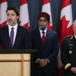Justin Trudeau standing behind podium