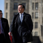 Finance Minister Bill Morneau heads to a press conference