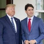 Donald Trump stands next to Justin Trudeau