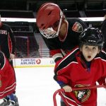 Newly arrived refugee children learn how to skate from Ottawa Senators staff in Ottawa