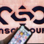 iPhone screen infront of NSO Group logo