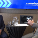 Scott Aitchison and Peter Loewen having a discussion on stage at a Munk School event