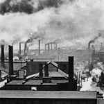 Image of industrialized cities, with smoke stacks