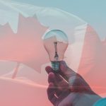 hand holding lightbulb and an image of the Canadian flag is overlaid