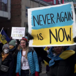 In February, thousands of people marched in downtown Toronto to denounce the Russian invasion of Ukraine. (Grant Linton/CBC)