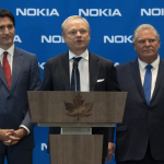 Prime Minister Justin Trudeau and Ontario Premier Doug Ford listen to Pekka Lundmark, CEO of Nokia, respond to a question following the announcement Monday of a major investment in Ontario. PHOTO BY ADRIAN WYLD /The Canadian Press
