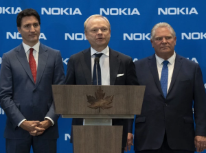 Prime Minister Justin Trudeau and Ontario Premier Doug Ford listen to Pekka Lundmark, CEO of Nokia, respond to a question following the announcement Monday of a major investment in Ontario. PHOTO BY ADRIAN WYLD /The Canadian Press