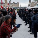 Police move in to clear downtown Ottawa near Parliament hill of protesters after weeks of demonstrations, Feb. 19, 2022.THE CANADIAN PRESS/Cole Burston