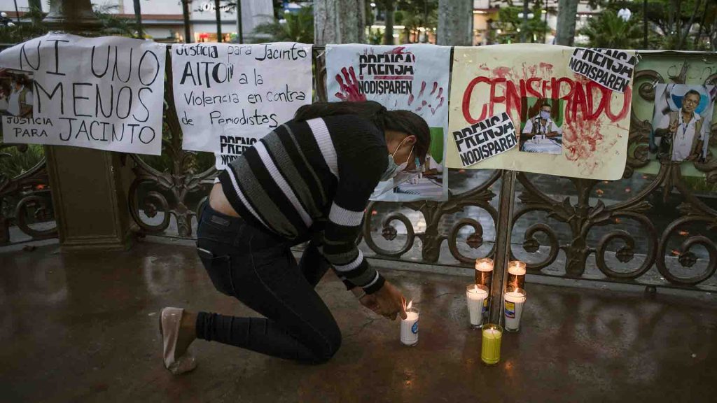 A woman lights a candle during a protest in demand of justice for the murder of Mexican journalist Jacinto Romero Flores, in Orizaba, state of Veracruz, Mexico on August 19, 2021. It was the latest such murder in one of the world’s deadliest countries for reporters.